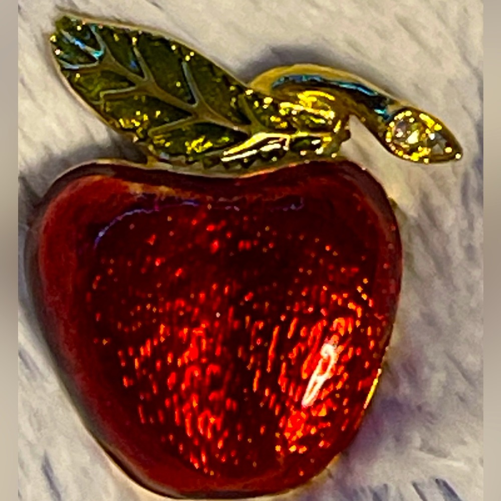 Vintage bright red Apple brooch with three clear stones set in the stem.